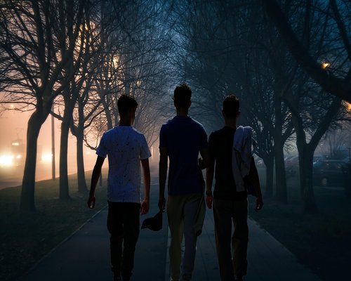 People walking in an urban park evening